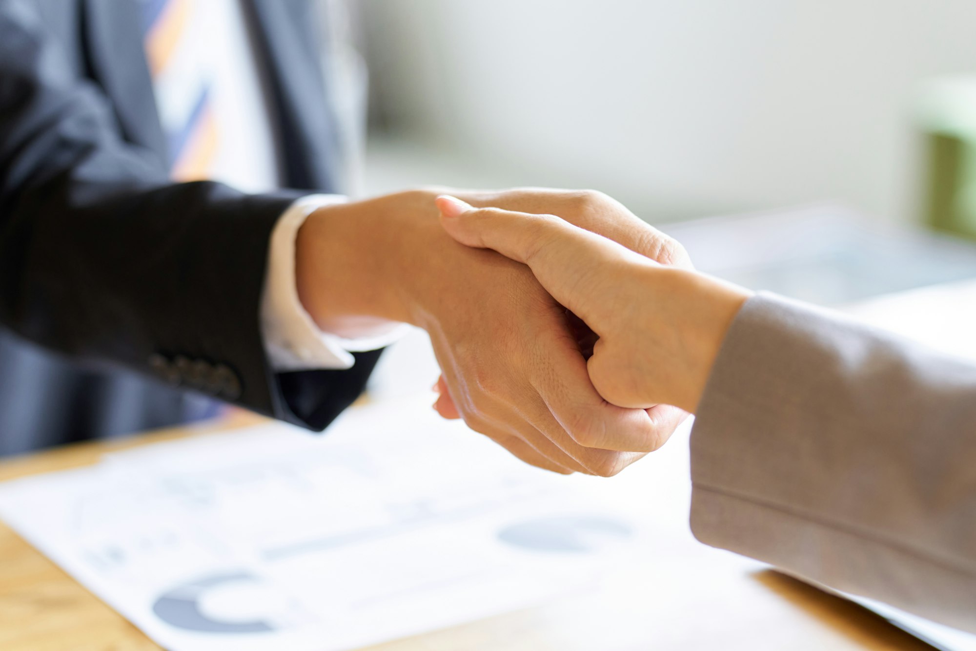 Business people shaking hands at a meeting